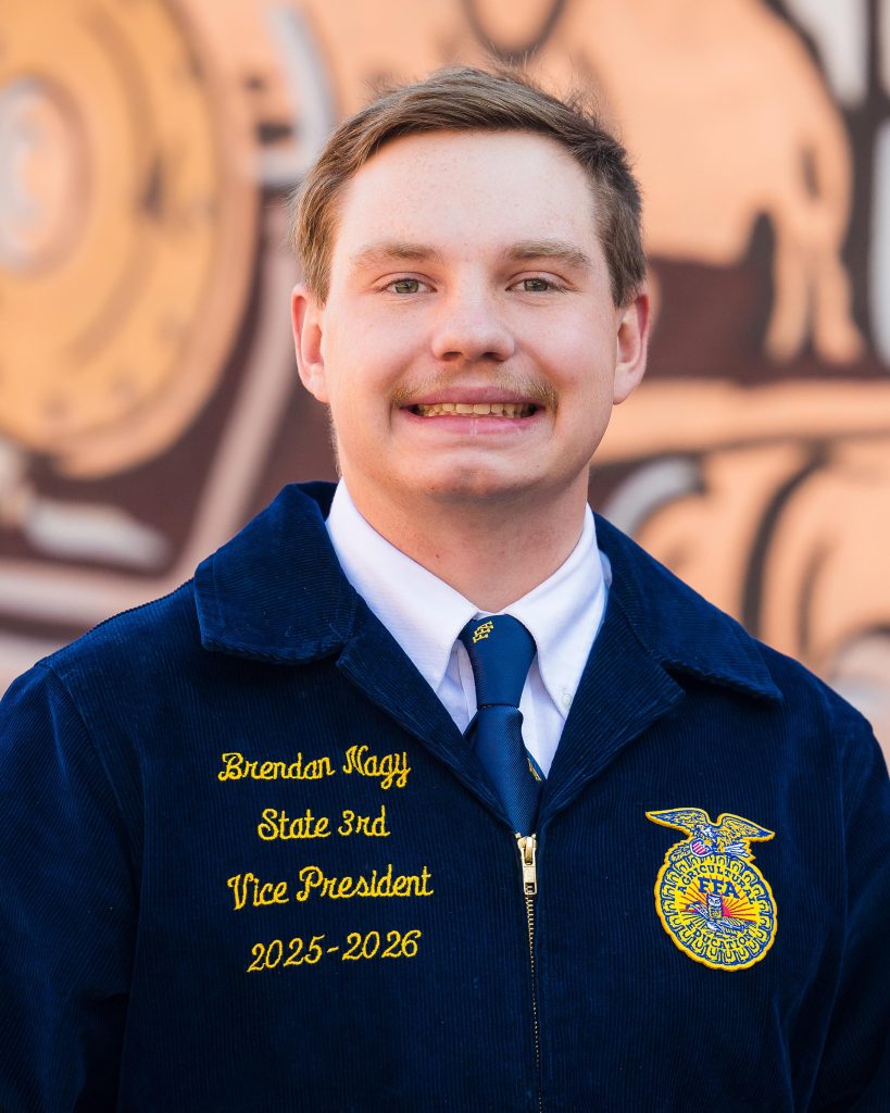 Professional headshot of a Wyoming FFA State Officer in official FFA blue jacket