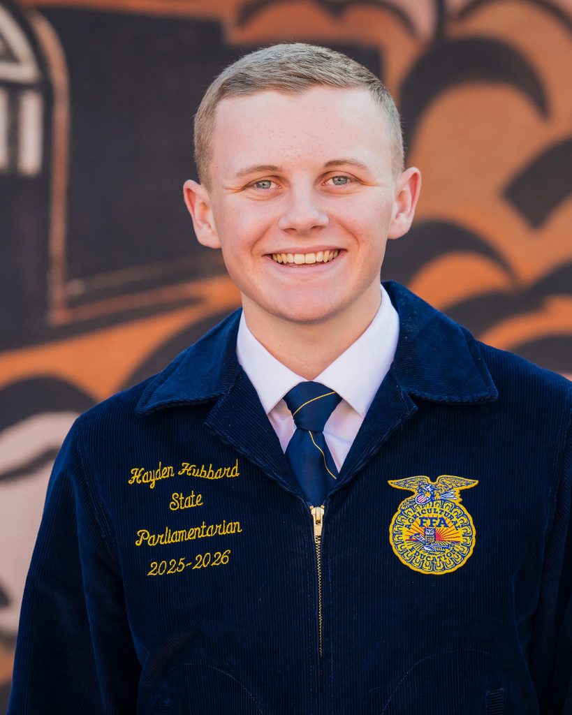 Professional headshot of a Wyoming FFA State Officer in official FFA blue jacket