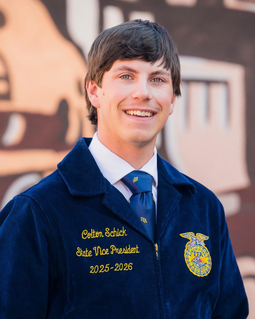 Professional headshot of a Wyoming FFA State Officer in official FFA blue jacket