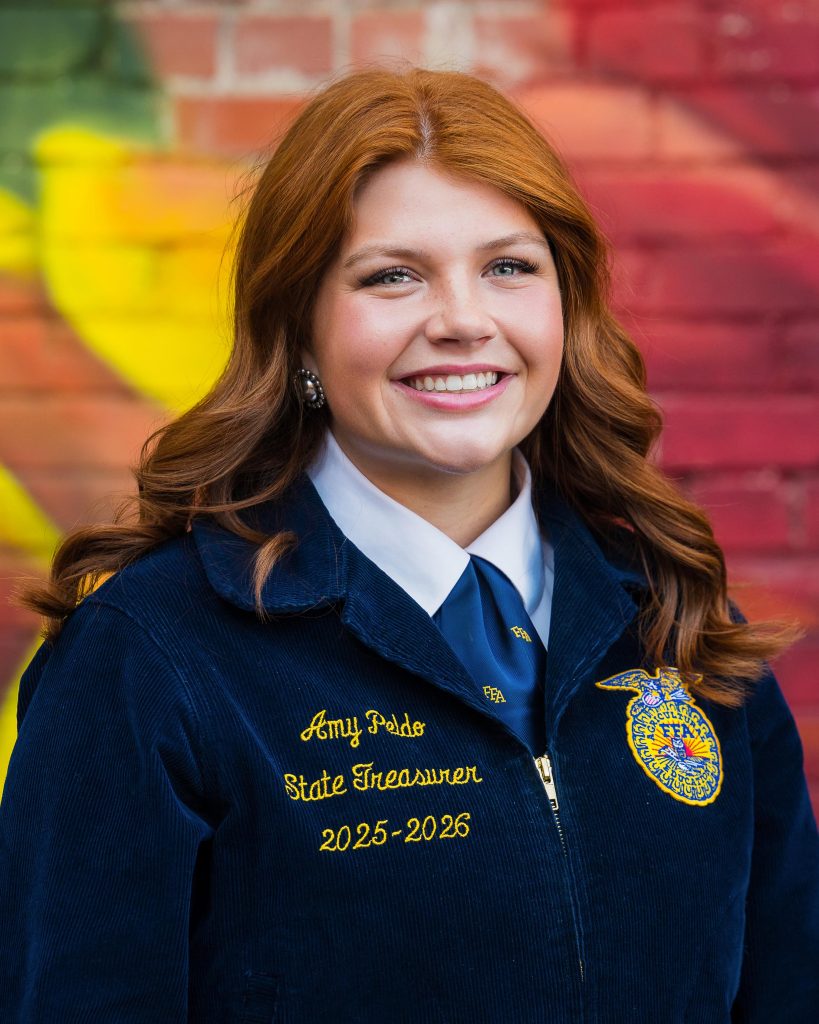 Professional headshot of a Wyoming FFA State Officer in official FFA blue jacket