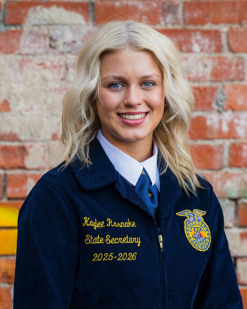 Professional headshot of a Wyoming FFA State Officer in official FFA blue jacket