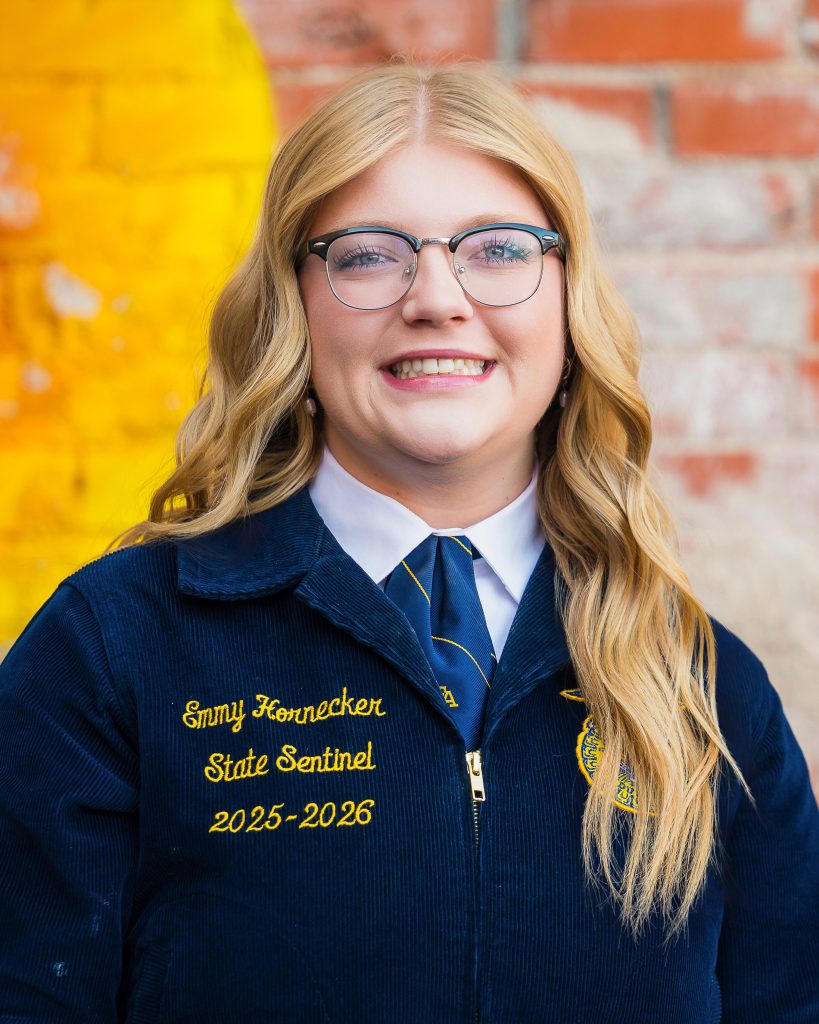 Professional headshot of a Wyoming FFA State Officer in official FFA blue jacket