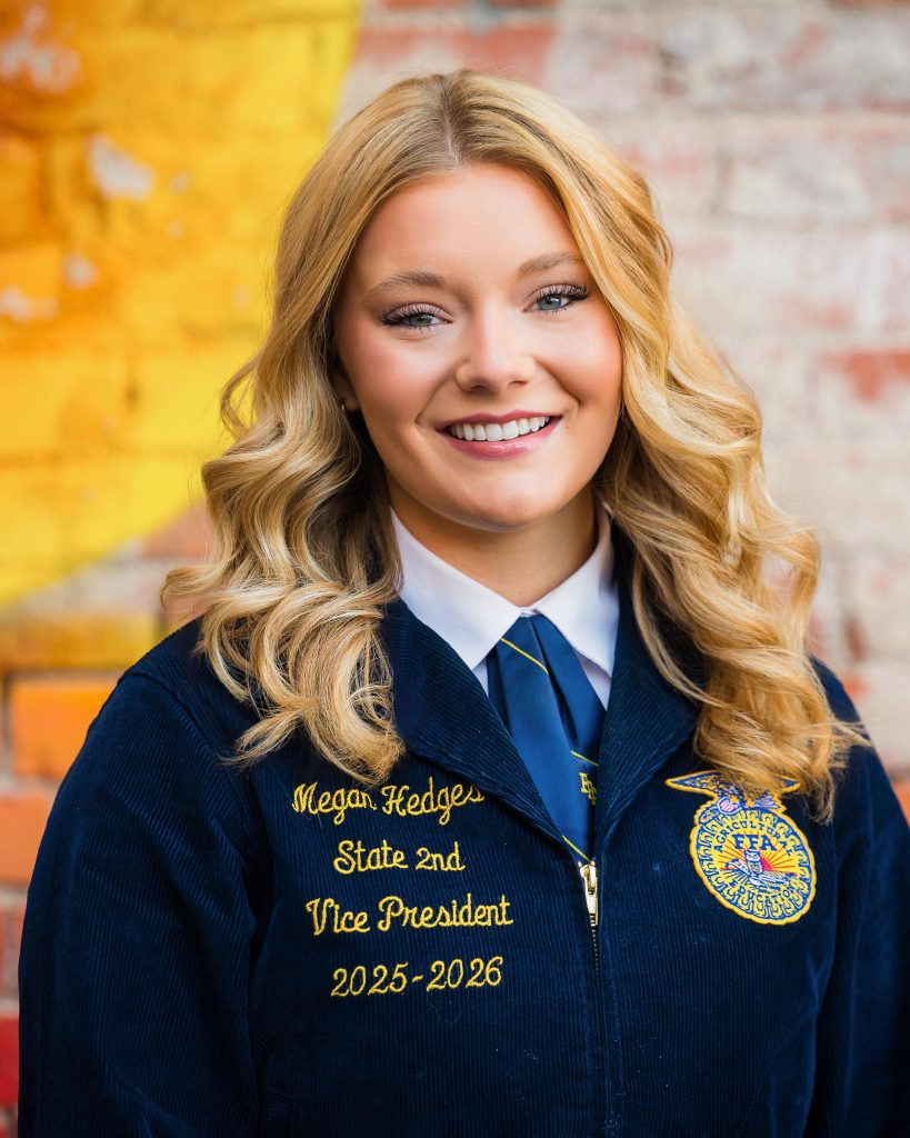 Professional headshot of a Wyoming FFA State Officer in official FFA blue jacket