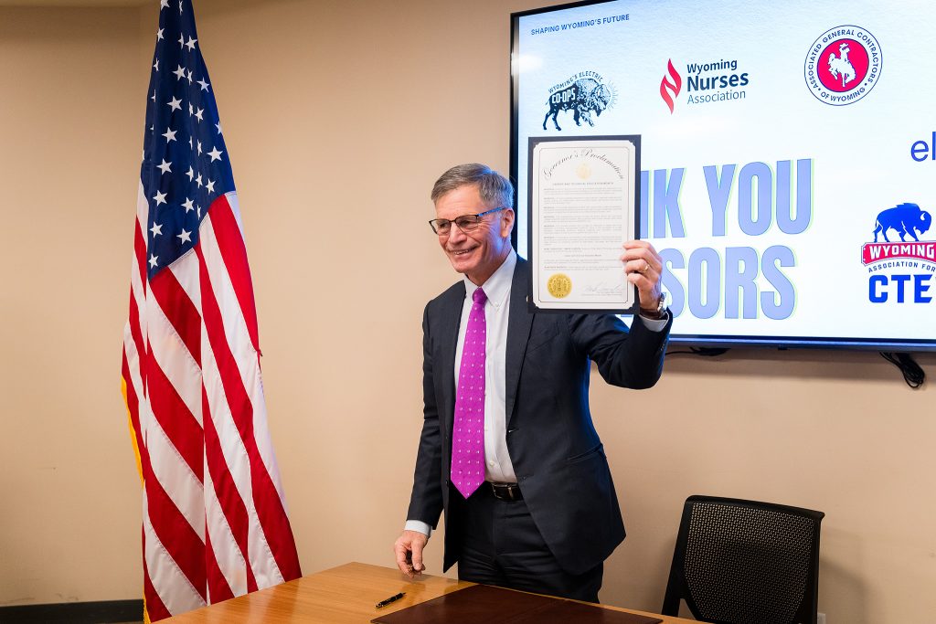 Governor Mark Gordon holds a signed proclamation declaring February as Career and Technical Education Month in Wyoming.